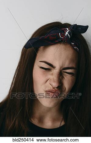 Close up of Caucasian woman making a face View Large Photo Image Picture - Close up of Caucasian woman making a face. Fotosearch