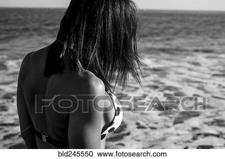 Stock Image - Close up of Caucasian woman wearing bikini on beach. Fotosearch