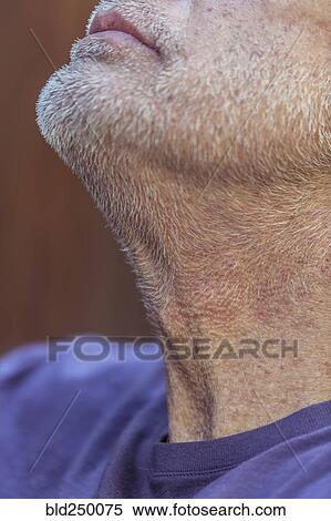 Stock Photography - Close up of chin and beard of Caucasian man looking up. Fotosearch
