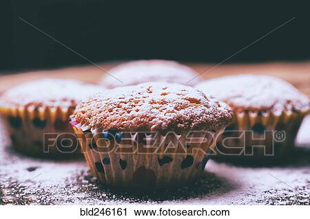Close up of cupcakes covered with powdered sugar View Large Photo Image Stock Image - Close up of cupcakes covered with powdered sugar. Fotosearch