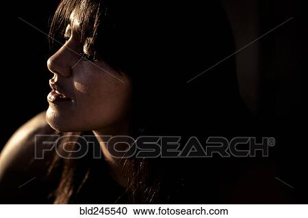 Stock Image - Close up of face of Caucasian woman. Fotosearch