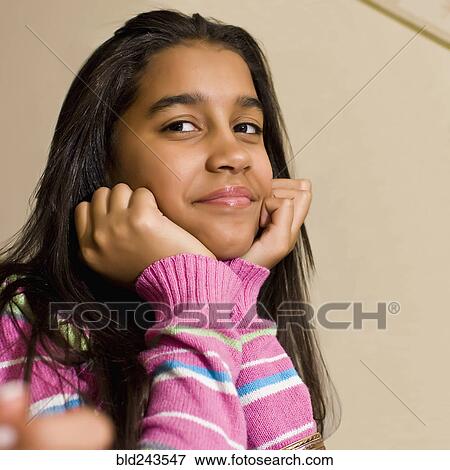 Stock Photo - Close up of smiling Hispanic girl. Fotosearch
