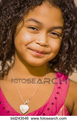 Close up of smiling Hispanic girl View Large Photo Image Stock Photograph - Close up of smiling Hispanic girl. Fotosearch