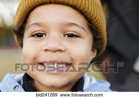 Close up of smiling Mixed Race boy View Large Photo Image Stock Photo - Close up of smiling Mixed Race boy. Fotosearch