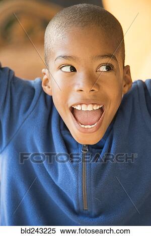 Stock Photography - Close up of smiling Mixed Race boy. Fotosearch