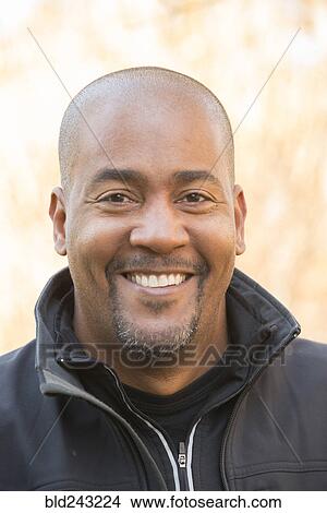 Close up of smiling Mixed Race man View Large Photo Image Picture - Close up of smiling Mixed Race man. Fotosearch