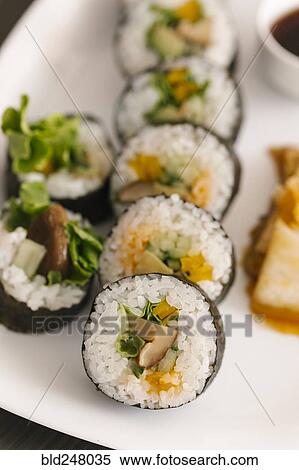 Close up of sushi on plate View Large Photo Image Stock Photography - Close up of sushi on plate. Fotosearch