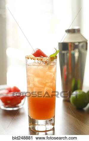 Cocktail on the table near cocktail shaker View Large Photo Image Stock Image - Cocktail on the table near cocktail shaker. Fotosearch