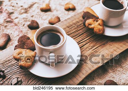 Coffee and heart-shape cookies on wooden tray View Large Photo Image Stock Photography - Coffee and heart-shape cookies on wooden tray. Fotosearch