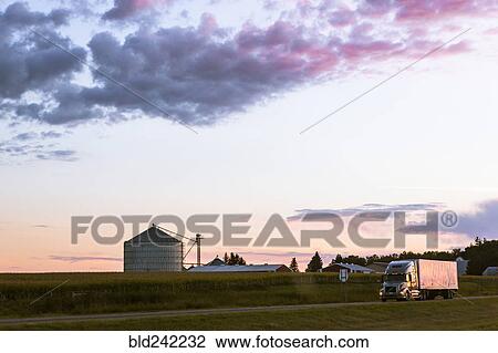 Colorful sunset over farm in rural landscape View Large Photo Image Stock Image - Colorful sunset over farm in rural landscape. Fotosearch