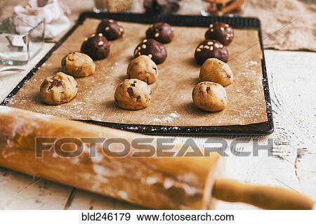 Cookie dough on baking sheet near rolling pin View Large Photo Image Stock Photo - Cookie dough on baking sheet near rolling pin. Fotosearch