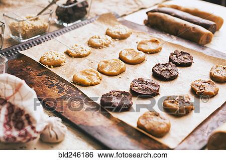 Stock Photograph - Cookies on baking sheet near ingredients. Fotosearch