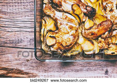 Stock Photo - Corner of potato and chicken casserole in baking dish. Fotosearch
