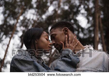 Picture - Couple rubbing noses. Fotosearch