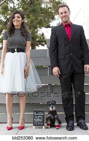 Couple with dog near wedding announcement View Large Photo Image Stock Image - Couple with dog near wedding announcement. Fotosearch