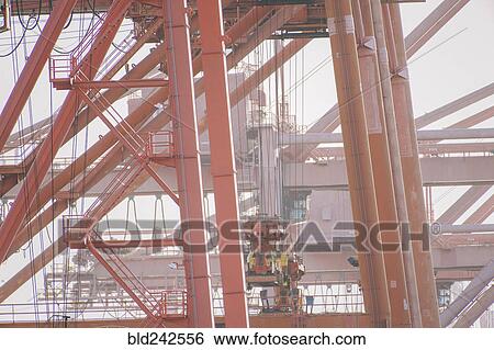 Cranes at shipping port View Large Photo Image Stock Photograph - Cranes at shipping port. Fotosearch