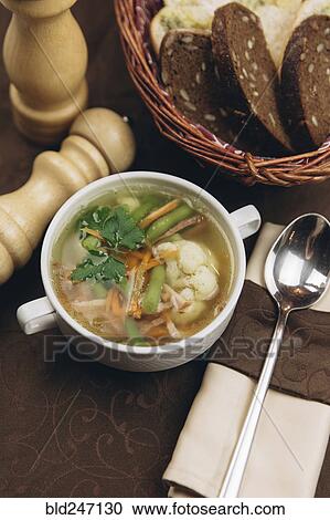 Cup of soup with bread View Large Photo Image Stock Image - Cup of soup with bread. Fotosearch