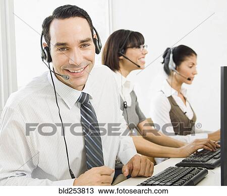 Customer service representatives wearing headsets using computers View Large Photo Image Stock Image - Customer service representatives wearing headsets using computers. Fotosearch