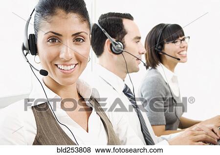 Customer service representatives wearing headsets View Large Photo Image Stock Photo - Customer service representatives wearing headsets. Fotosearch