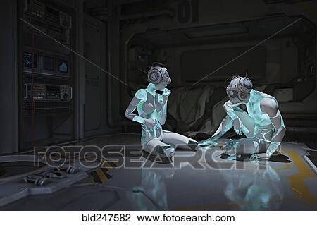 Stock Image - Cyborgs sitting on floor wearing virtual reality helmets. Fotosearch