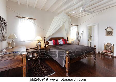 Desk and bed in bedroom View Large Photo Image Stock Photo - Desk and bed in bedroom. Fotosearch