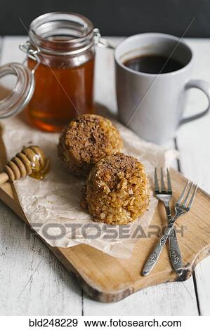 Stock Photo - Dessert cakes with coffee and honey. Fotosearch