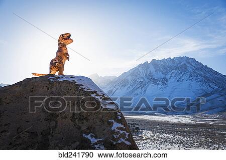 Dinosaur statue on rock View Large Photo Image Stock Image - Dinosaur statue on rock. Fotosearch