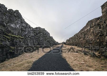 Dirt path between rock formations View Large Photo Image Stock Photo - Dirt path between rock formations. Fotosearch
