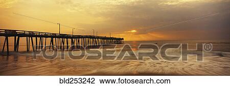 Stock Image - Dock at still lake. Fotosearch