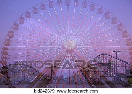 Double exposure of ferris wheel and roller coaster View Large Photo Image Stock Photo - Double exposure of ferris wheel and roller coaster. Fotosearch