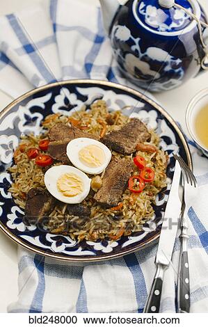 Eggs and meat on rice View Large Photo Image Stock Image - Eggs and meat on rice. Fotosearch
