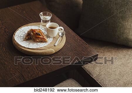 Espresso and dessert on cutting board View Large Photo Image Stock Image - Espresso and dessert on cutting board. Fotosearch