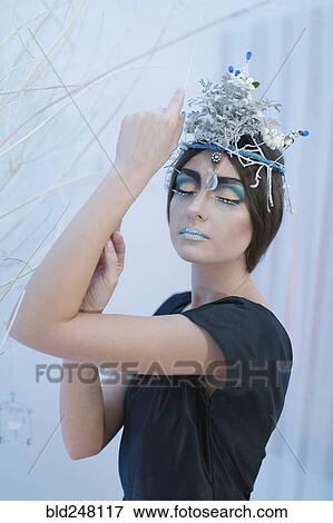 Stock Photo - Ethereal woman wearing dress and makeup. Fotosearch