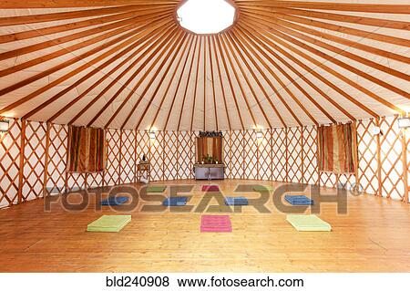 Stock Photo - Exercise mats in empty yurt. Fotosearch