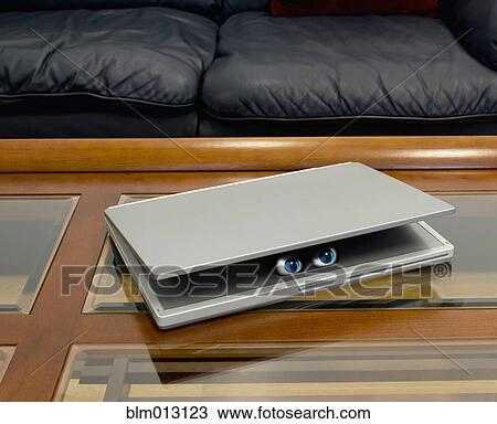 Eyes peering out of laptop View Large Photo Image Stock Image - Eyes peering out of laptop. Fotosearch