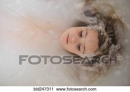 Face of Caucasian girl floating in bubble bath View Large Photo Image Stock Image - Face of Caucasian girl floating in bubble bath. Fotosearch