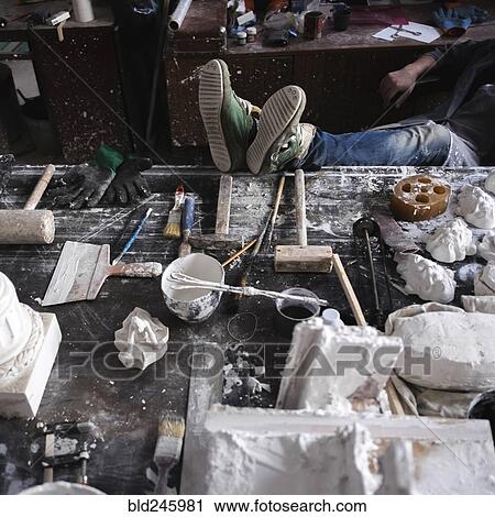 Feet of Caucasian sculptor on table View Large Photo Image Stock Image - Feet of Caucasian sculptor on table. Fotosearch