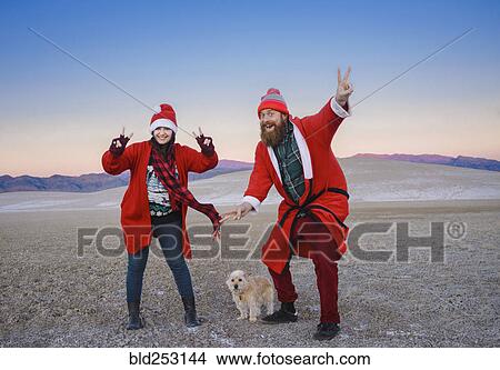 Festive couple celebrating Christmas in the desert View Large Photo Image Picture - Festive couple celebrating Christmas in the desert. Fotosearch