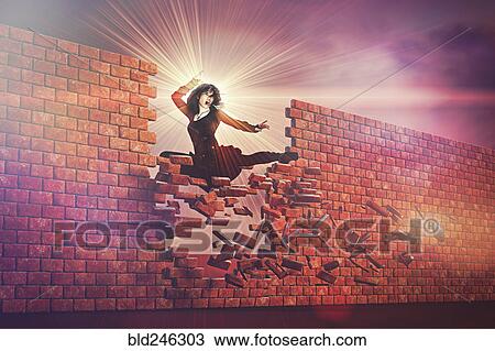 Fierce woman kicking through brick wall View Large Photo Image Stock Image - Fierce woman kicking through brick wall. Fotosearch