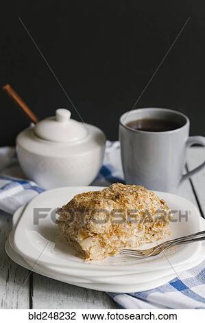 Flaky pastry on plate with coffee View Large Photo Image Stock Image - Flaky pastry on plate with coffee. Fotosearch