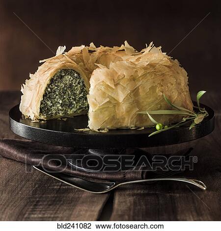Flaky spanikopita missing slice View Large Photo Image Stock Image - Flaky spanikopita missing slice. Fotosearch