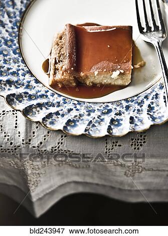 Stock Photo - Flan on plate with syrup and fork. Fotosearch