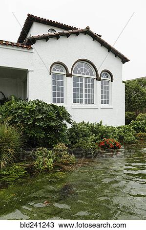 Stock Image - Flooding near house. Fotosearch