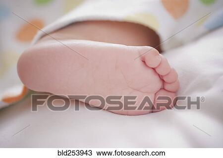 Stock Image - Foot of Hispanic baby boy. Fotosearch