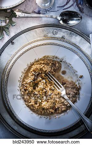 Fork in mushroom risotto View Large Photo Image Stock Image - Fork in mushroom risotto. Fotosearch