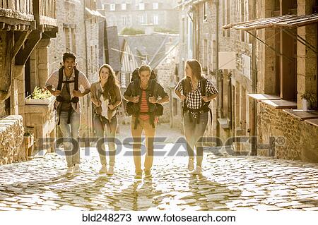 Friends backpacking in city View Large Photo Image Stock Image - Friends backpacking in city. Fotosearch