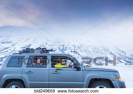 Friends looking from car window in winter View Large Photo Image Stock Photo - Friends looking from car window in winter. Fotosearch