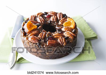 Fruit cake with pecans on plate View Large Photo Image Picture - Fruit cake with pecans on plate. Fotosearch