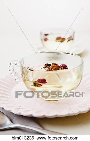 Stock Photograph - Fruit in cup of tea. Fotosearch