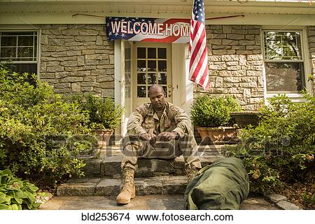 Frustrated African American soldier sitting on front stoop View Large Photo Image Picture - Frustrated African American soldier sitting on front stoop. Fotosearch